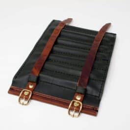 A black and brown Handmade Leather Pen Roll with two handles.