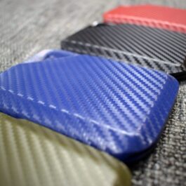 a close up of a Kydex Wallet on the ground.
