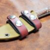 A Horizontal Kydex Sheath for the Chris Reeve Nyala on a table.