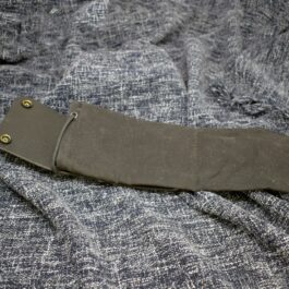 A Waxed Canvas Bushcraft Foraging/Dump Pouch laying on top of a piece of cloth.