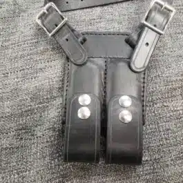 A Shoulder Holster For Full Size 1911 on a gray cloth.