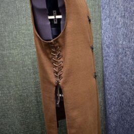 A Wool Ranger Jerkin with a tie on a mannequin.