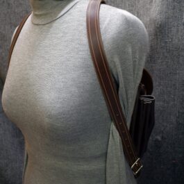 a female mannequin with a Leather Cinch Top Backpack.