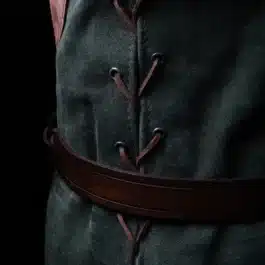 A close up of a person wearing a Suede Elven Jerkin.