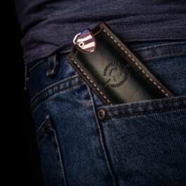 a Medford Gentleman Jack leather pocket slip with a lighter in it.