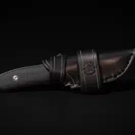 a Protech SBR with a Handmade Leather Sheath on a black background.