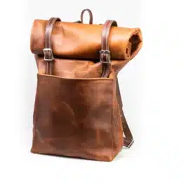 A Bison Leather Roll Top Rucksack on a white background.