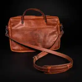 A Bison Leather Briefcase Satchel on a black background.