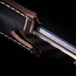 A close up of a Leather Pocket Slip for the Medford Gentleman Jack on a black background.