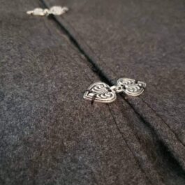 A close up of a Wool Ranger Jerkin necklace.