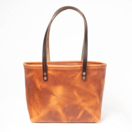 A Horween Leather tote bag on a white background.