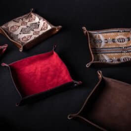 A Handmade Leather Valet Tray sitting on top of a table.