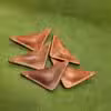 Four pieces of NFL Leather Finger Football sitting on a green surface.