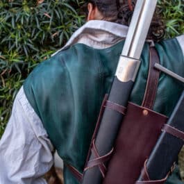 A man with a Monster Hunter Sword Carrier in his back.