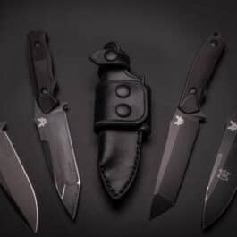 a Waxed Canvas Duffel Bag on a black surface.