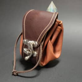 A brown Handmade Leather Dice Bag with a metal clasp.