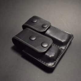 A Ruger Lc9 Double Magpouch sitting on top of a table.