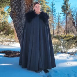 a woman in the woords wearing a Northerner Cloak - renaissance clothing - renaissance clothing men - renaissance clothing women - renaissance clothing near me - renaissance art clothing - renaissance era clothing - renaissance costume ideas
