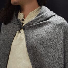 a man with long hair wearing a wool tweed hooded cloak - renaissance clothing - renaissance clothing men - renaissance clothing women - renaissance clothing near me - renaissance art clothing - renaissance era clothing - renaissance costume ideas