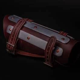 A pair of Splinted Vambraces with two straps on a black background.