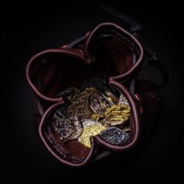 a heart shaped box filled with lots of Leather Coin Pouches.
