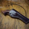a Crossdraw Gunslinger Holster on a table.