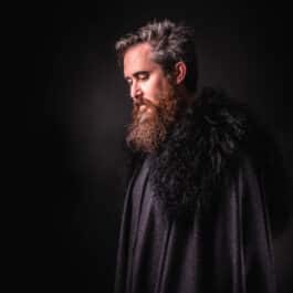 a man with beard wearing a Northerner Cloak - renaissance clothing - renaissance clothing men - renaissance clothing women - renaissance clothing near me - renaissance art clothing - renaissance era clothing - renaissance costume ideas