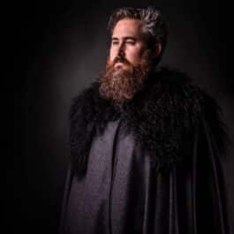 a man with a beard wearing a Northerner Cloak - renaissance clothing - renaissance clothing men - renaissance clothing women - renaissance clothing near me - renaissance art clothing - renaissance era clothing - renaissance costume ideas