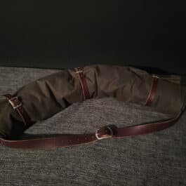A Ranger Bedroll sitting on top of a couch.