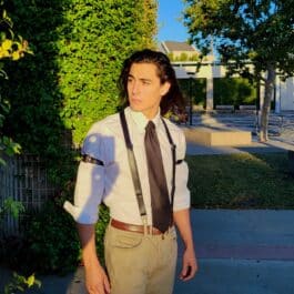 A young man wearing Upgraded Leather Sleeve Garters.