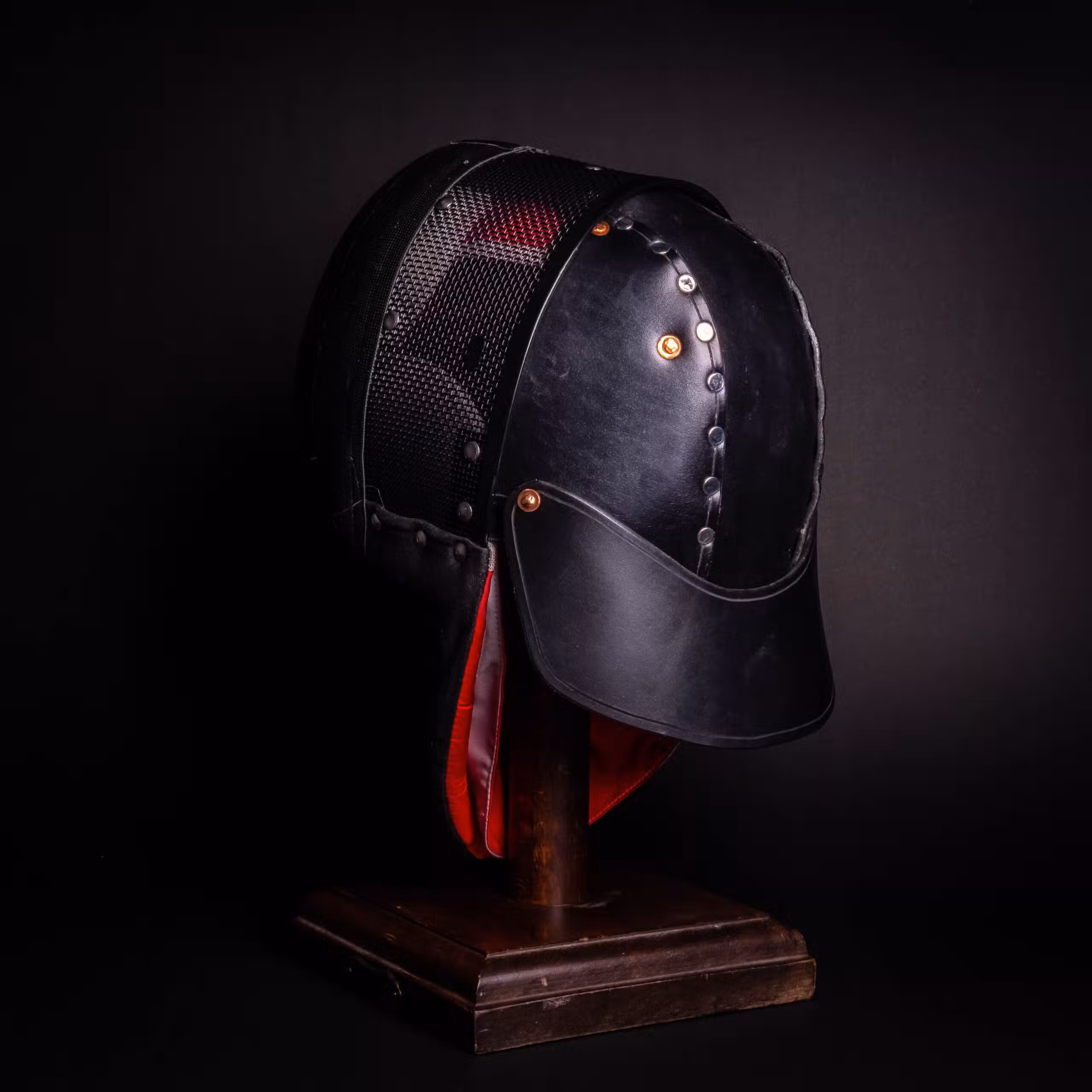 A Leather Back of Head Protector Version 2 with a red ribbon around it.