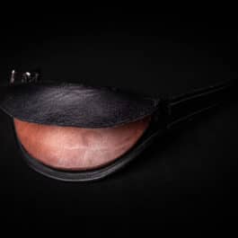 a close up of a Simple Gorget on a black surface.