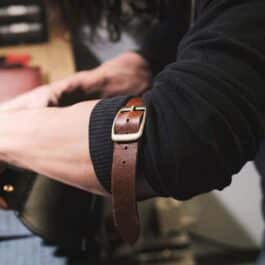 A person wearing Upgraded Leather Sleeve Garters.