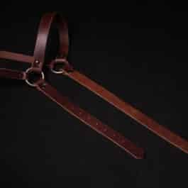 A Monster Hunter Chest Harness on a black background.