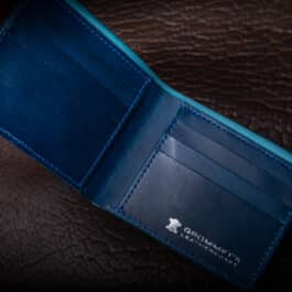 An Emerald Green Shell Cordovan Bifold Wallet with a credit card slot.