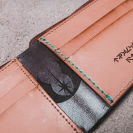 An Old Ben Bifold Wallet with a Star Wars logo on it.