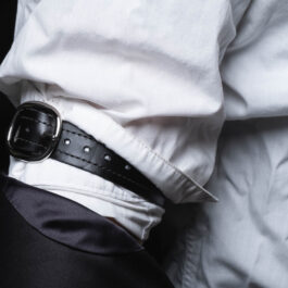 A person wearing Leather Dress Suspenders.