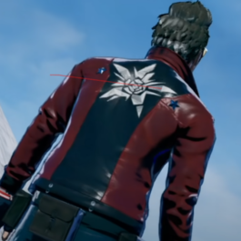 A man in a red and black Custom Jacket standing next to a tall building.