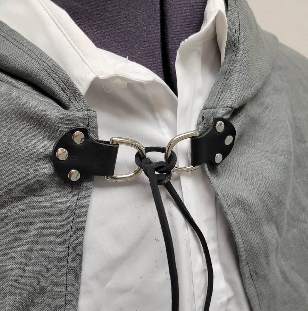 a close up of a person wearing a jacket and tie.