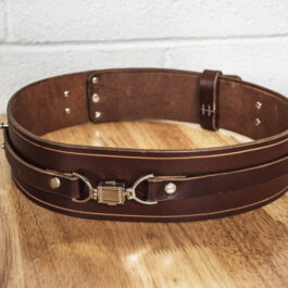 A brown Leather Space Wizard Pouch on a wooden table.