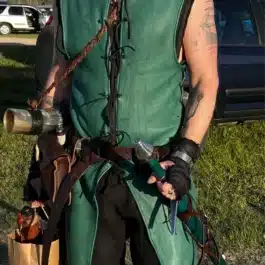a man wearing a green Deerskin Ranger Jerkin - renaissance clothing - renaissance clothing men - renaissance clothing women - renaissance clothing near me - renaissance art clothing - renaissance era clothing - renaissance costume ideas