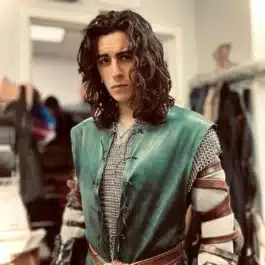 a man with long hair wearing a green Deerskin Ranger Jerkin - renaissance clothing - renaissance clothing men - renaissance clothing women - renaissance clothing near me - renaissance art clothing - renaissance era clothing - renaissance costume ideas