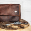 The "Marston" Satchel sitting on top of a wooden table.