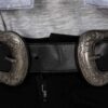 a woman wearing a Custom Belt with a silver buckle.