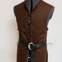 A Wool Strider Jerkin with a black belt on a mannequin.