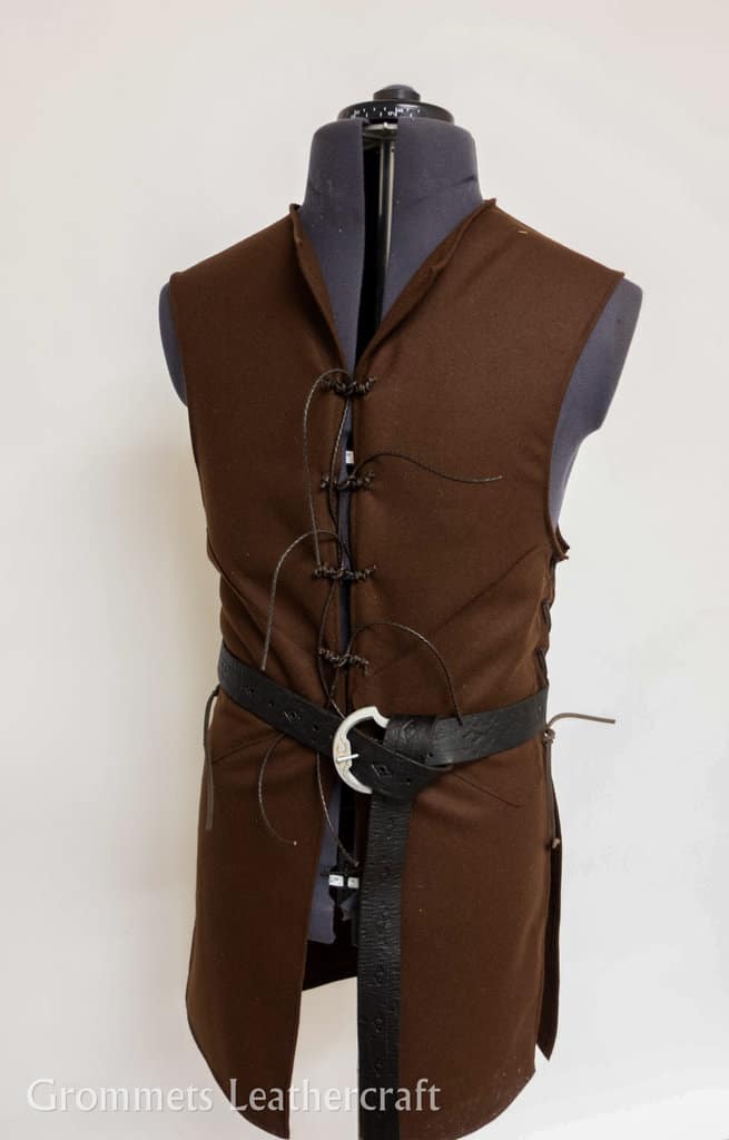 A Wool Strider Jerkin with a black belt on a mannequin.