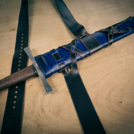 a Wood Core Scabbard for the Albion Royal Armories I:33 on a wooden table.