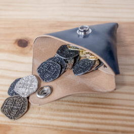 a blue shell cordovan cin pouch, open to view the coins inside