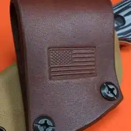 a leather loop attached to a kydex sheath a a 45 degree angle
