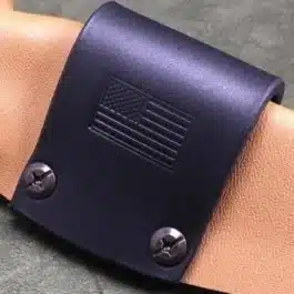 a single leather strap wrapped around a kydex sheath